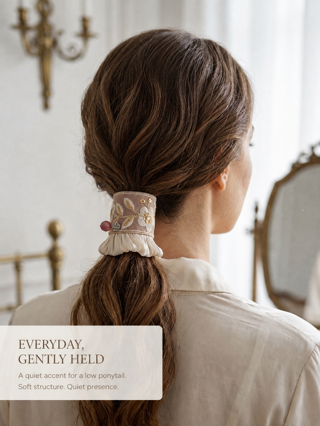 Rosewood Bloom Pleat worn as a quiet low ponytail accent