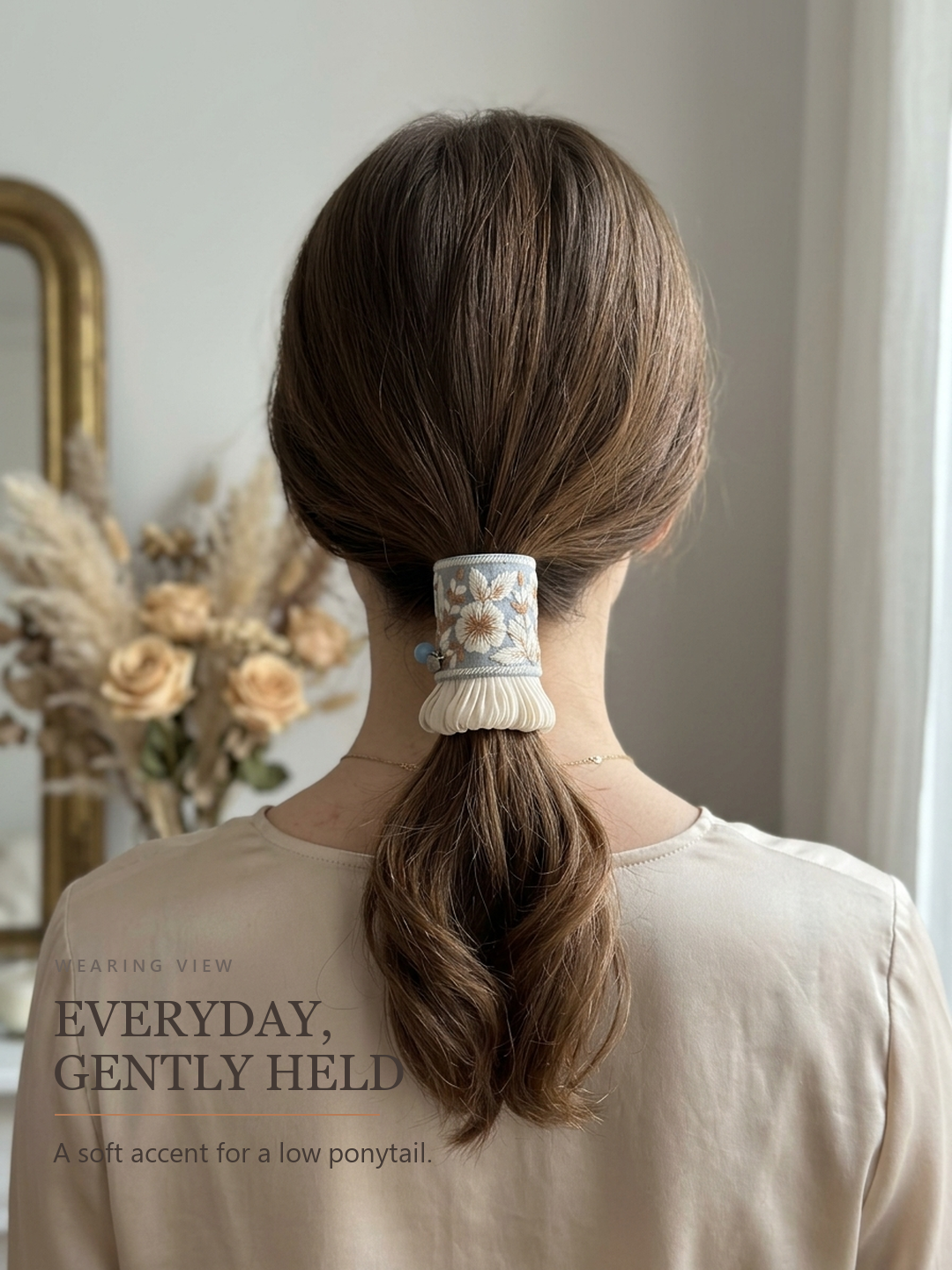 Bluebell Garden Pleat wearing view on a low ponytail