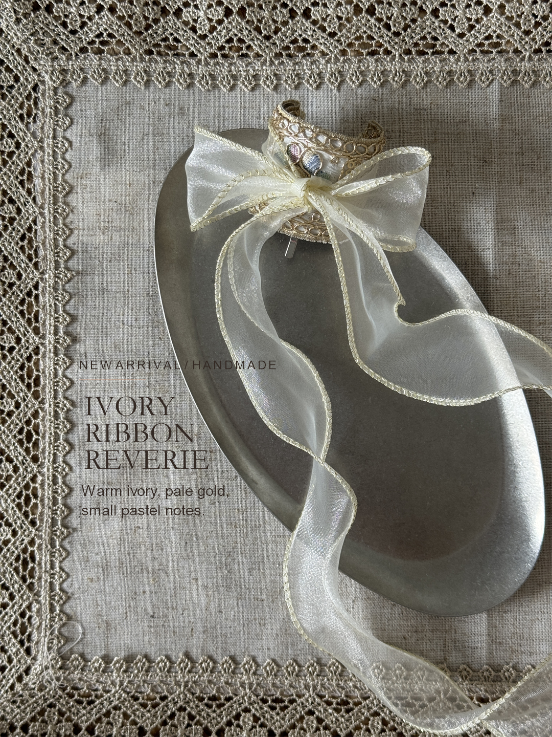 Ivory Ribbon Reverie editorial still life with warm ivory embroidery and pale gold details