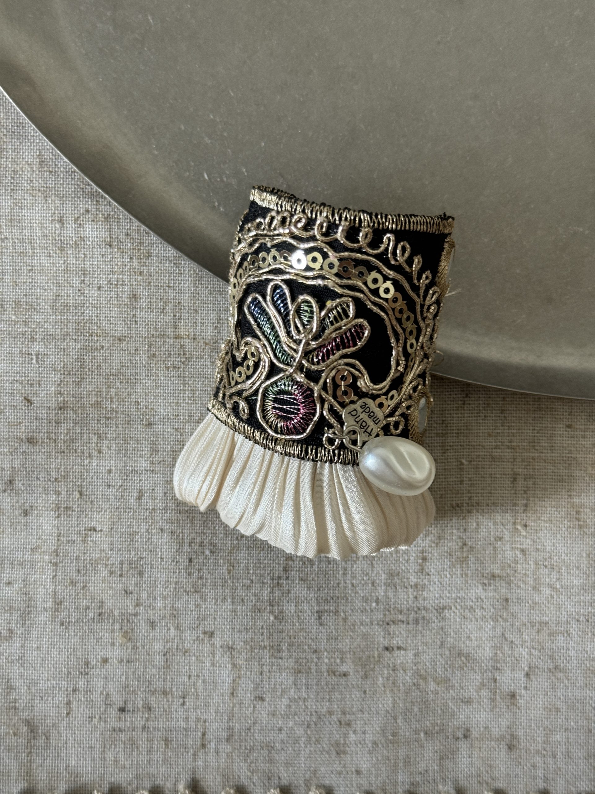 Midnight Gold Pleat black embroidered hair cuff with gold details, ivory pleats and pearl-look accent